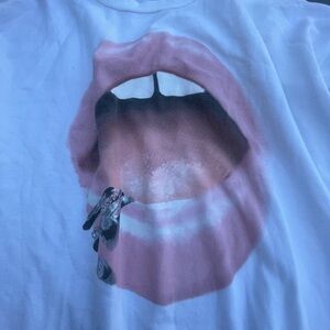 super cute thin material crewneck. with lips. white base and long sleeves